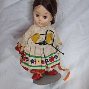 Charming Doll with Floral Dress and Red Shoes